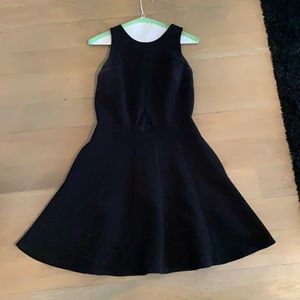 Black cocktail dress with cutout detail